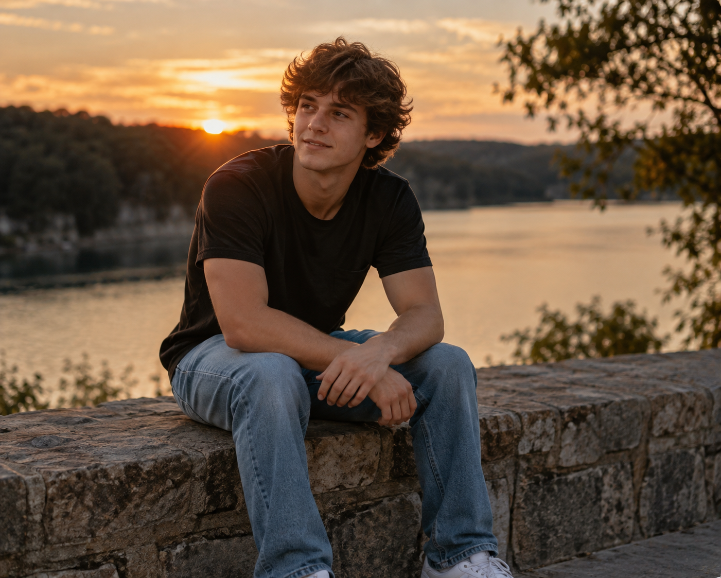 Senior portrait at sunset overlooking the water